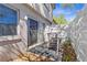 Relaxing outdoor patio with seating and a privacy fence at 2646 Barksdale Ct, Clearwater, FL 33761