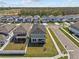 Aerial view of home in a community offering tree lined streets and well maintained landscaping at 28889 Orange Berry # Dr, Wesley Chapel, FL 33543