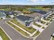 Aerial view of homes with a pond in a well-maintained residential community at 28889 Orange Berry # Dr, Wesley Chapel, FL 33543