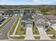 Beautiful aerial view of community and home with a manicured lawn at 28889 Orange Berry # Dr, Wesley Chapel, FL 33543
