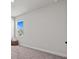 Simple empty bedroom featuring a view through the window; ready for personalization at 28889 Orange Berry # Dr, Wesley Chapel, FL 33543