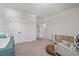 Bright Bedroom area shows a crib, rocking chair, and changing table with ample space at 28889 Orange Berry # Dr, Wesley Chapel, FL 33543