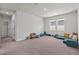 Large bonus room with carpet flooring, great natural light, and a cozy spot to relax at 28889 Orange Berry # Dr, Wesley Chapel, FL 33543