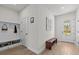 Inviting entryway with a bench and coat rack, perfect for organization at 28889 Orange Berry # Dr, Wesley Chapel, FL 33543