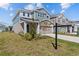 Attractive two-story home with a manicured lawn, complemented by a two car garage at 28889 Orange Berry # Dr, Wesley Chapel, FL 33543