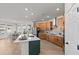 Modern kitchen featuring a central island with a white countertop and wood cabinets, ample counter space at 28889 Orange Berry # Dr, Wesley Chapel, FL 33543