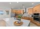 Bright kitchen with stainless steel appliances, a large island, and light wood cabinetry at 28889 Orange Berry # Dr, Wesley Chapel, FL 33543