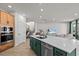 Lovely kitchen featuring a large island, stainless steel appliances, wood cabinets, and an open floor plan at 28889 Orange Berry # Dr, Wesley Chapel, FL 33543