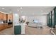 Open-concept kitchen, living room, and stairway create a bright, modern, and comfortable living space at 28889 Orange Berry # Dr, Wesley Chapel, FL 33543