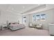 Spacious primary bedroom with tray ceiling and three large windows at 28889 Orange Berry # Dr, Wesley Chapel, FL 33543