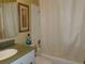 Bathroom with a bathtub and shower combination featuring a green countertop and neutral decor at 2960 59Th S St # 501, Gulfport, FL 33707