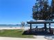 Picturesque beach scene with people relaxing and a covered picnic area on a sunny day at 2960 59Th S St # 501, Gulfport, FL 33707