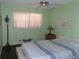 Bedroom with large windows and ceiling fan at 2960 59Th S St # 501, Gulfport, FL 33707