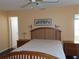 Cozy bedroom showcasing a wood-framed bed, bedside tables, and serene decor at 2960 59Th S St # 501, Gulfport, FL 33707