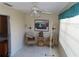 Bright living room with ceiling fan, two chairs, and window with blinds at 2960 59Th S St # 501, Gulfport, FL 33707
