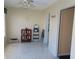 Bright living room featuring tile floors and an adjacent room at 2960 59Th S St # 501, Gulfport, FL 33707