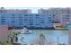 Waterfront view showcases a boat dock, calm waters, and residential buildings at 2960 59Th S St # 501, Gulfport, FL 33707