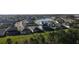 Aerial view of neighborhood homes surrounding a scenic lake at 33410 Castaway Loop, Wesley Chapel, FL 33543