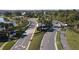 Community entrance with road signs and lush palm tree landscaping at 33410 Castaway Loop, Wesley Chapel, FL 33543