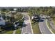 Community entrance with road signs and lush palm tree landscaping at 33410 Castaway Loop, Wesley Chapel, FL 33543