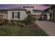 Charming single-story home with well-maintained landscaping and a two-car garage at 33410 Castaway Loop, Wesley Chapel, FL 33543