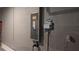 Garage interior featuring an electrical panel and smart home irrigation system at 33410 Castaway Loop, Wesley Chapel, FL 33543