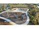 Aerial view of a nautical themed playground surrounded by a walking path and green space at 33410 Castaway Loop, Wesley Chapel, FL 33543