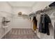 Walk-in closet with built-in shelving for optimal organization and storage at 33410 Castaway Loop, Wesley Chapel, FL 33543