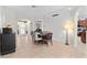Bright dining room features a tile floor, a wooden dining set, and a buffet on the left at 3629 Mossy Oak Cir, Land O Lakes, FL 34639