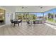 Spacious screened-in patio with ceiling fans and comfortable seating, perfect for enjoying outdoor living at 3629 Mossy Oak Cir, Land O Lakes, FL 34639