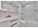Updated bathroom with contemporary vanity, sleek fixtures, modern lighting, and a tiled shower-tub combo at 370 S Woodlands Dr, Oldsmar, FL 34677