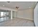 Bright bedroom with sliding glass doors and wood-look floors, filled with plenty of natural light at 370 S Woodlands Dr, Oldsmar, FL 34677