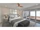 Modern bedroom with direct outdoor access through sliding glass doors to private courtyard at 370 S Woodlands Dr, Oldsmar, FL 34677