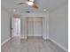Bright bedroom with wood-look floors, and a large closet, providing a comfortable living space at 370 S Woodlands Dr, Oldsmar, FL 34677