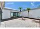 Private courtyard with brick pavers, mature landscaping, and modern glass sliders at 370 S Woodlands Dr, Oldsmar, FL 34677