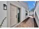 Charming home entrance with a decorative front door and sidelight at 370 S Woodlands Dr, Oldsmar, FL 34677