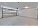 Bright and clean two-car garage with speckled floor and automatic door at 370 S Woodlands Dr, Oldsmar, FL 34677