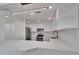 Open concept kitchen boasting quartz countertops, stainless appliances, and modern lighting at 370 S Woodlands Dr, Oldsmar, FL 34677