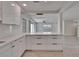 Bright, open kitchen with large island and seamless flow into the living area at 370 S Woodlands Dr, Oldsmar, FL 34677