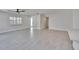 Spacious living room with light wood floors and plenty of natural light at 370 S Woodlands Dr, Oldsmar, FL 34677