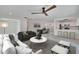 Bright, open-concept living room flowing into the dining area and kitchen, perfect for modern living at 370 S Woodlands Dr, Oldsmar, FL 34677