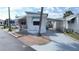 Charming mobile home with awnings, an American flag and a driveway at 4851 W Gandy Blvd # B1L14, Tampa, FL 33611