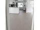 An open-concept living space into the kitchen at 4851 W Gandy Blvd # B1L14, Tampa, FL 33611