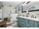 Nicely appointed bathroom featuring double sinks, custom vanity, and glass shower at 5133 Glenn Dr, New Port Richey, FL 34652