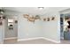 Hallway with coastal decor and neutral paint leads to other areas of the home at 5133 Glenn Dr, New Port Richey, FL 34652