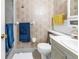 Traditional bathroom with white fixtures, floral wallpaper, and ample lighting for a functional space at 5347 81St N Ln # 25, St Petersburg, FL 33709