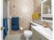 Cozy bathroom featuring floral wallpaper, standard fixtures, and a shower at 5347 81St N Ln # 25, St Petersburg, FL 33709