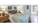 Cozy bedroom with a decorative headboard and side tables, offering a comfortable and inviting space at 5347 81St N Ln # 25, St Petersburg, FL 33709