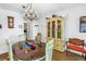 Elegant dining area featuring decorative lighting, hardwood floors, and open plan living at 5347 81St N Ln # 25, St Petersburg, FL 33709