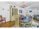 Formal dining room featuring a china cabinet, decorative chandelier, and wooden table at 5347 81St N Ln # 25, St Petersburg, FL 33709